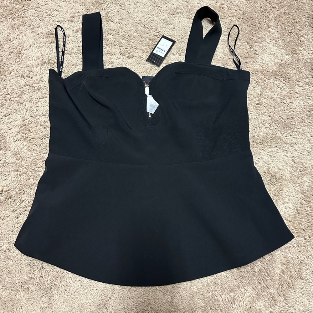 Black peplum top with zipper accent